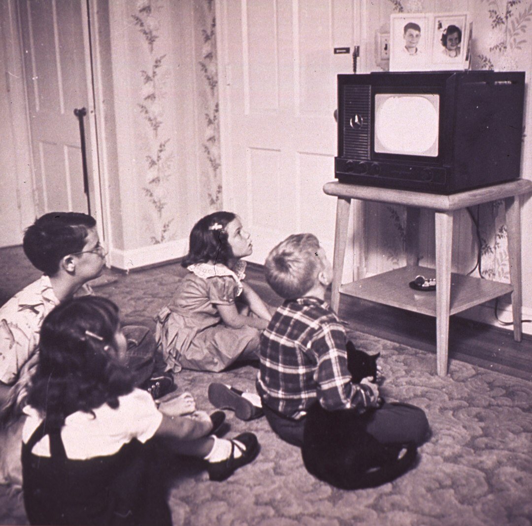 Panoramic view of a television regie room with editorial team working